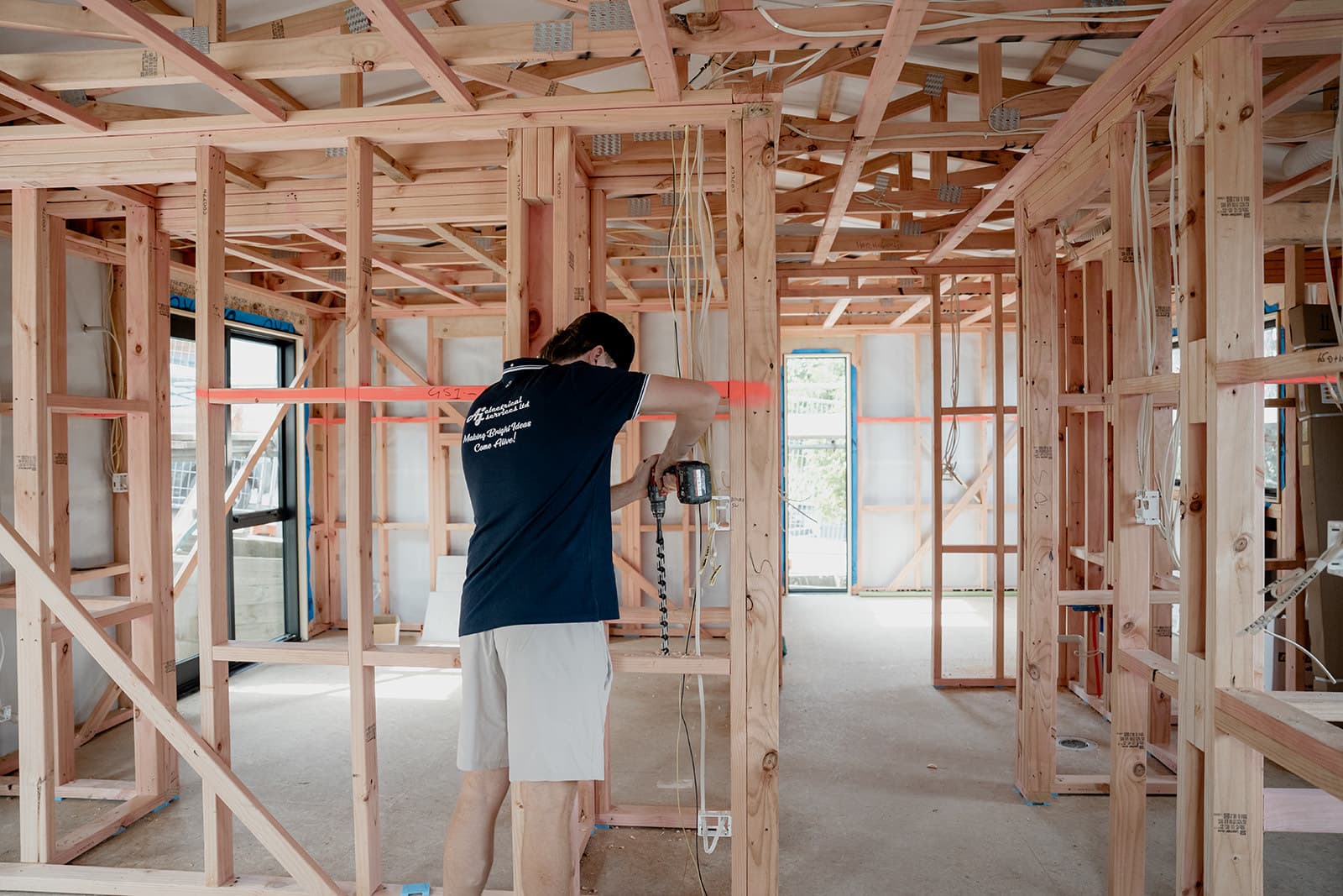 An AJ Electrical electrician wiring a new build