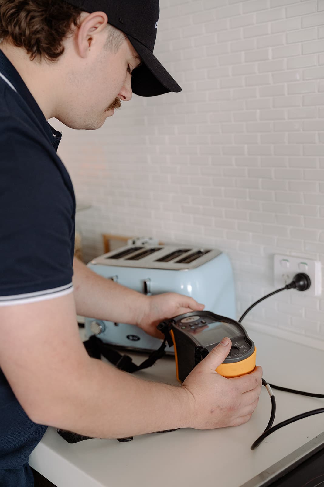 Testing an appliance at a kitchen power point